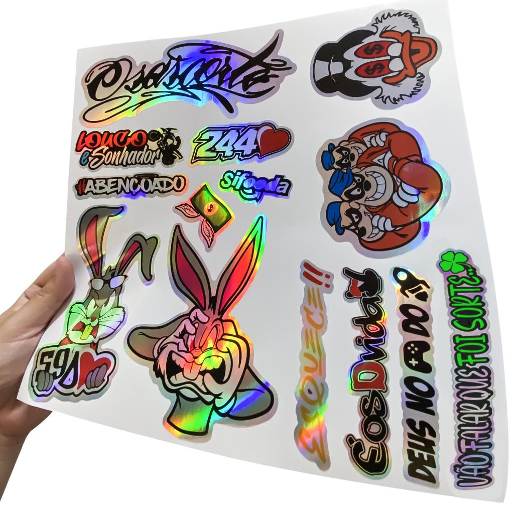 Kit 14 Adesivos Holografico Cartela 244 Abençoado Osascorte Louco Moto Carro Capacete Camaleão